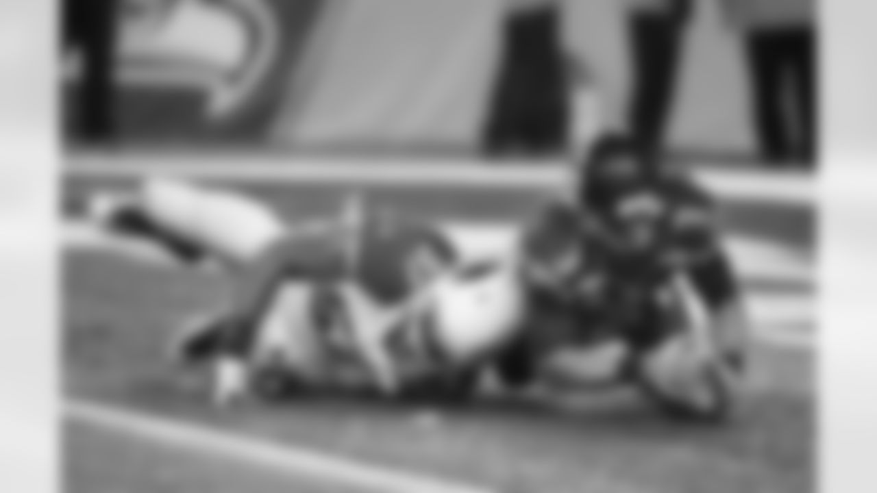 Seahawks QB Russell Wilson jumps on a fumble for a safety