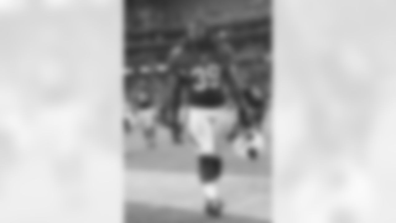 RB Robert Hughes walks off the field