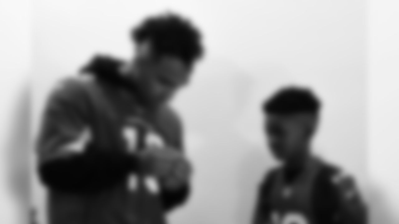 Images of Cardinals receiver Christian Kirk delivering surprise Super Bowl tickets to Devin Manigo at his home in Texas