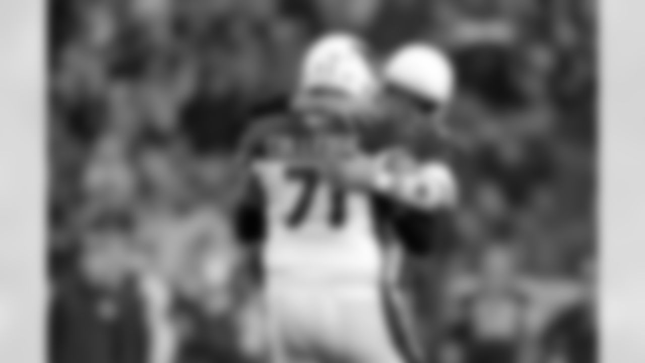 2013: QB Carson Palmer hugs G Daryn Colledge after throwing a touchdown pass