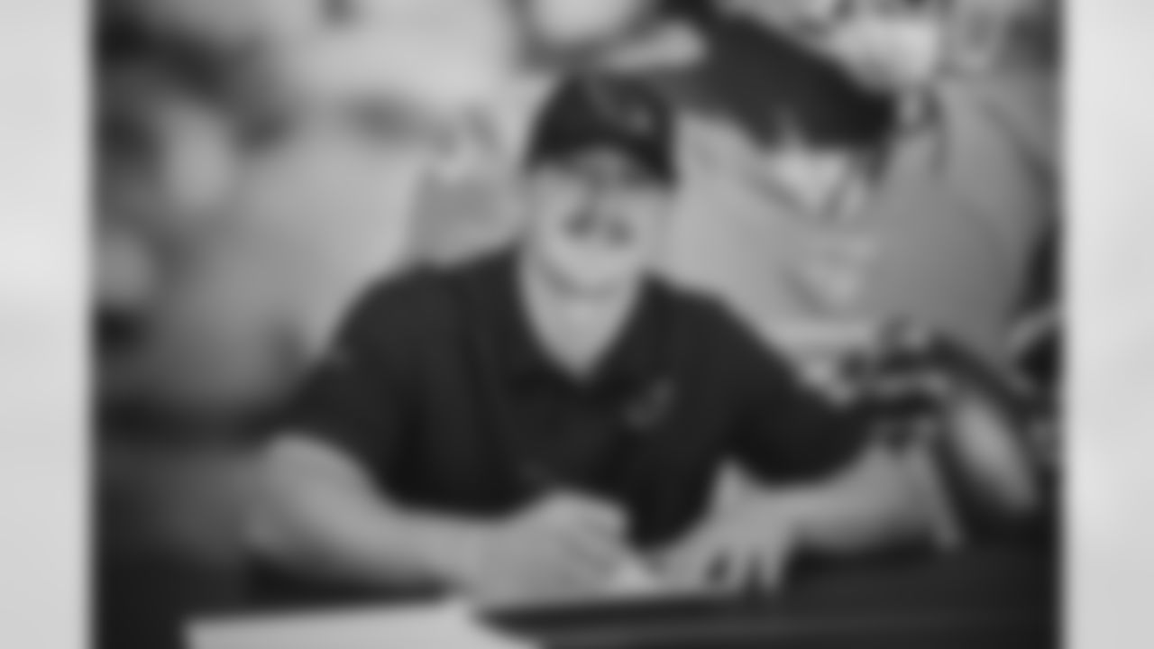 LB Nick Vigil smiles during the contract signing.