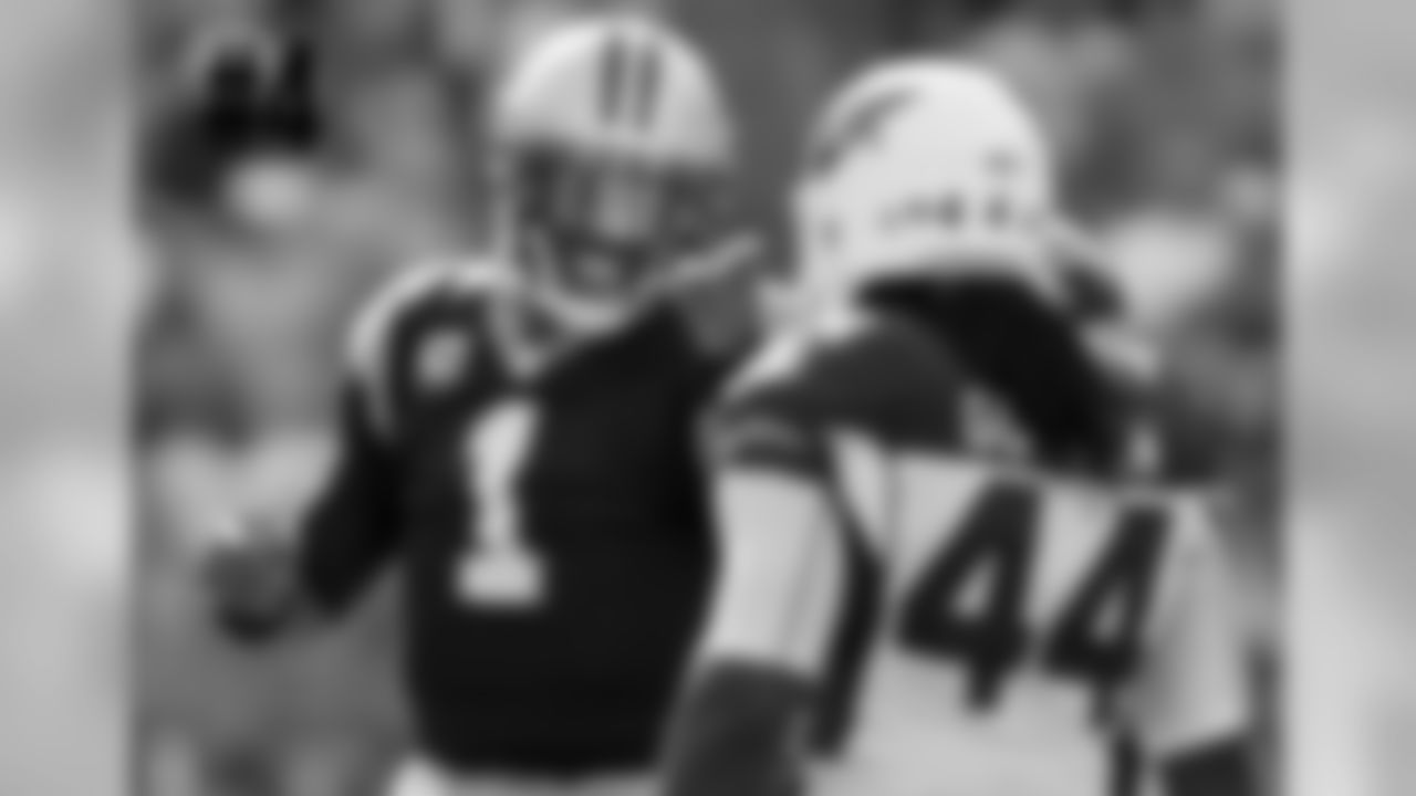 Panthers QB Cam Newton points at Cardinals OLB Markus Golden