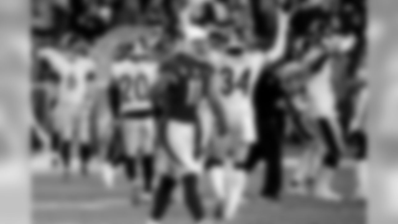 Cardinals wide receiver Larry Fitzgerald leaves the field after a game-ending interception by the Steelers during the second half.