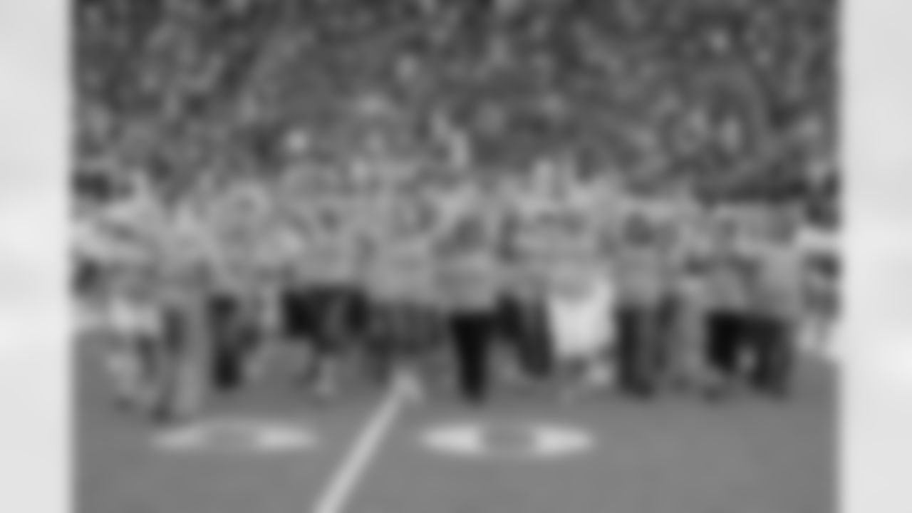 Breast Cancer survivors perform with the Cheerleaders
