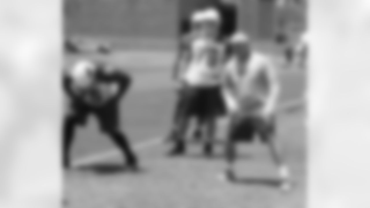 Assistant OL coach Larry Zierlein gets his point across