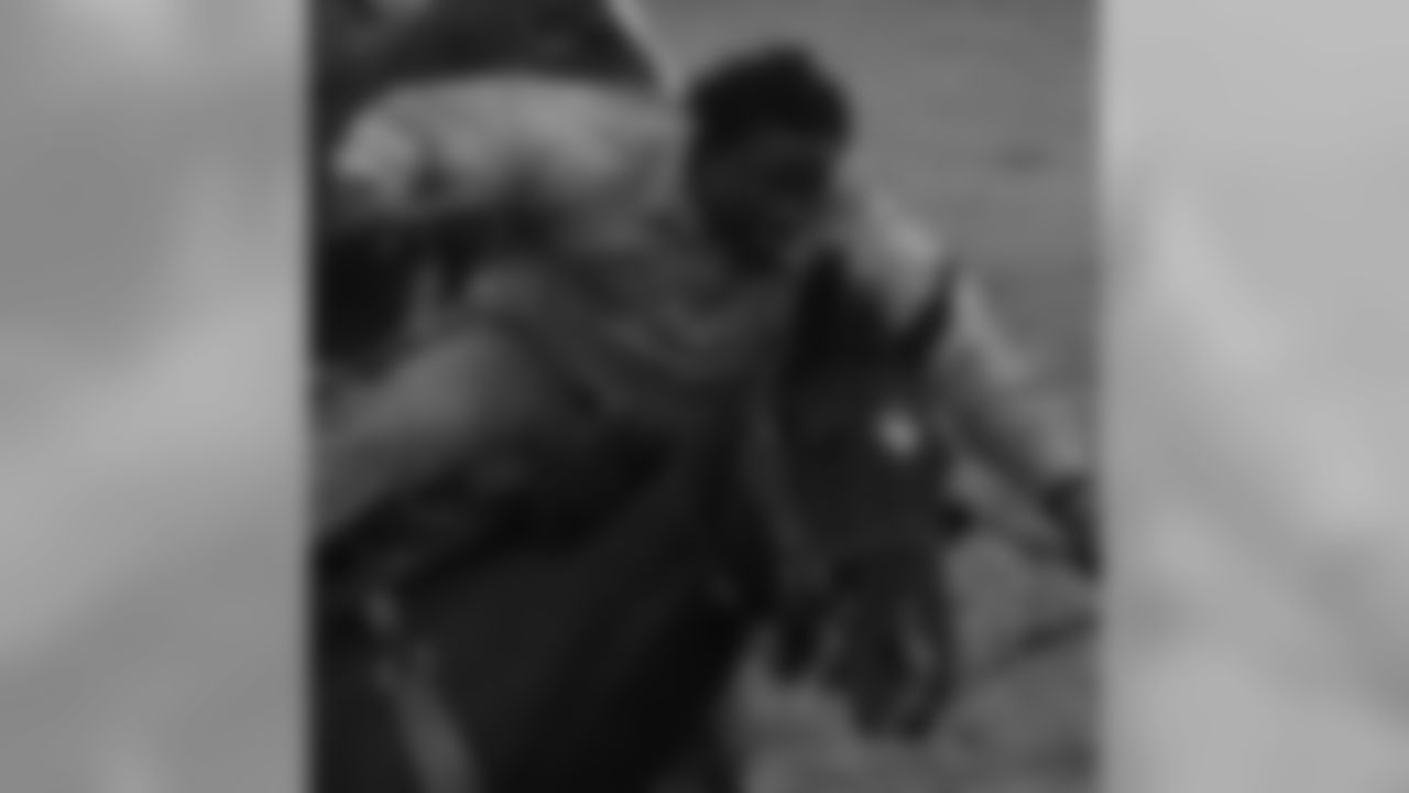 RB Robert Hughes riding a horse