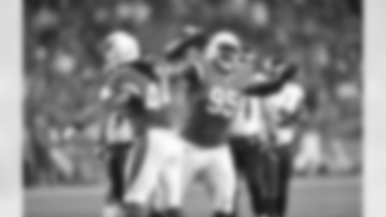 LB Markus Golden (left) celebrates with DT Rodney Gunter