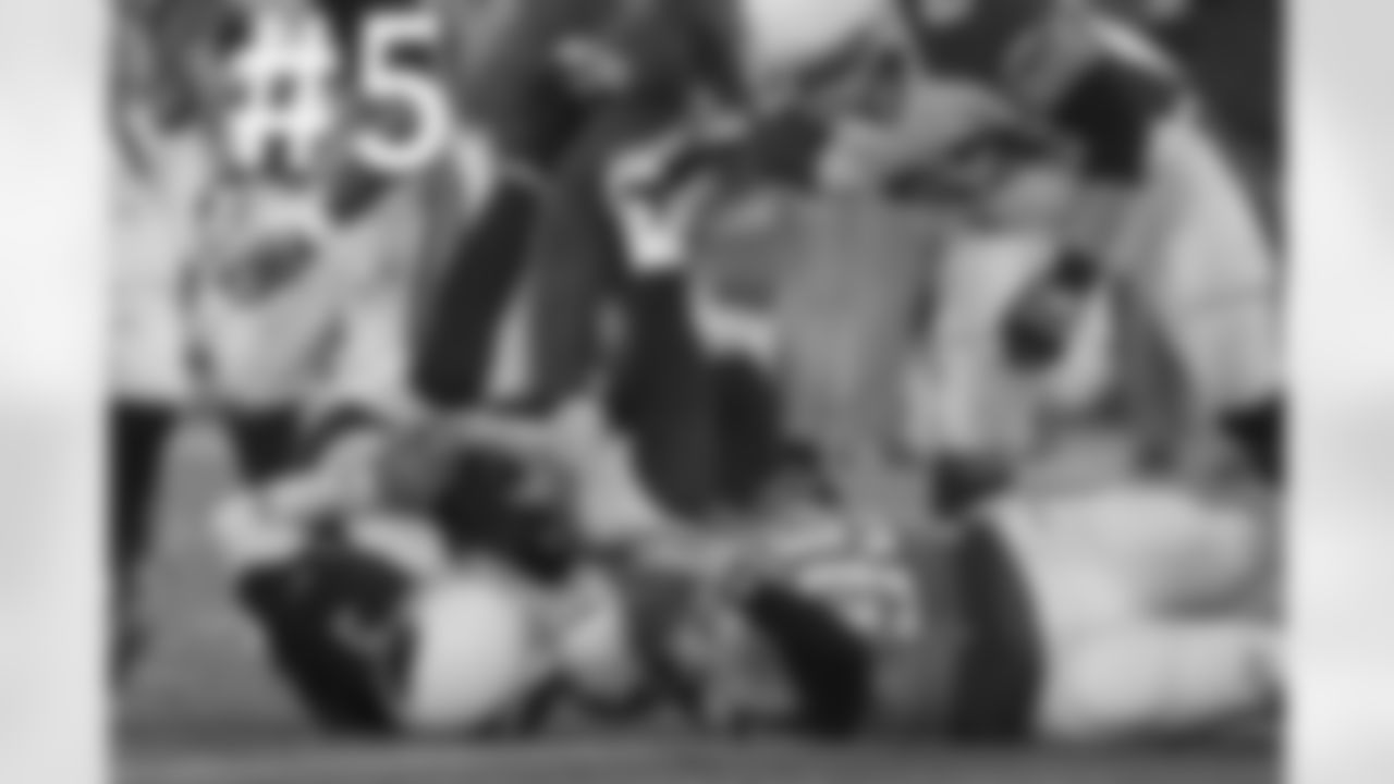QB Carson Palmer is upside down after a sack.