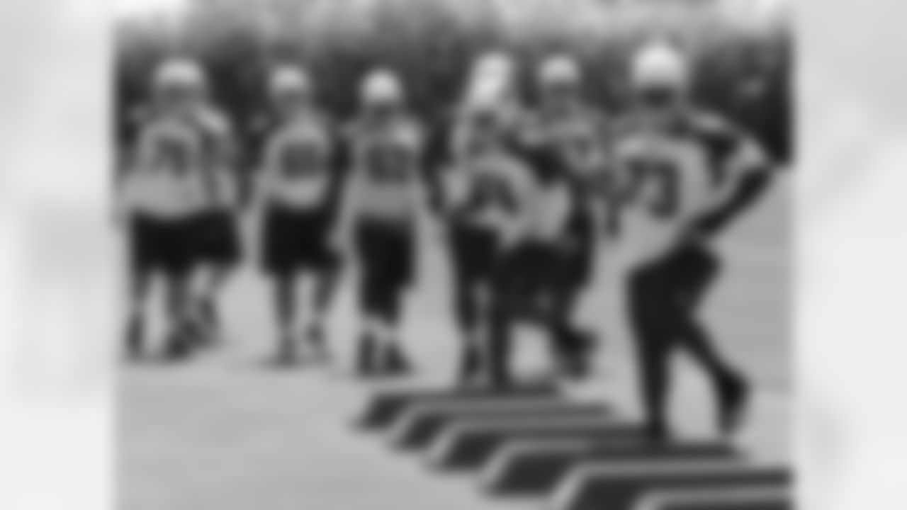 Offensive linemen work on footwork
