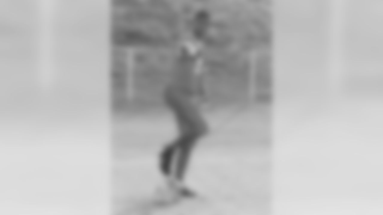 A very young Adrian as high school football star.