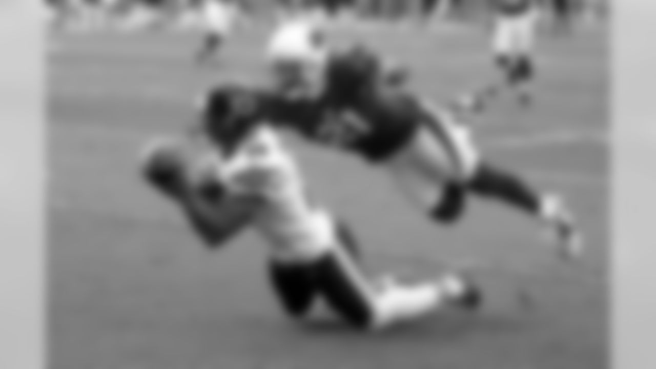 2012: Bears WR Brandon Marshall attempts to haul in a pass as CB Patrick Peterson covers him