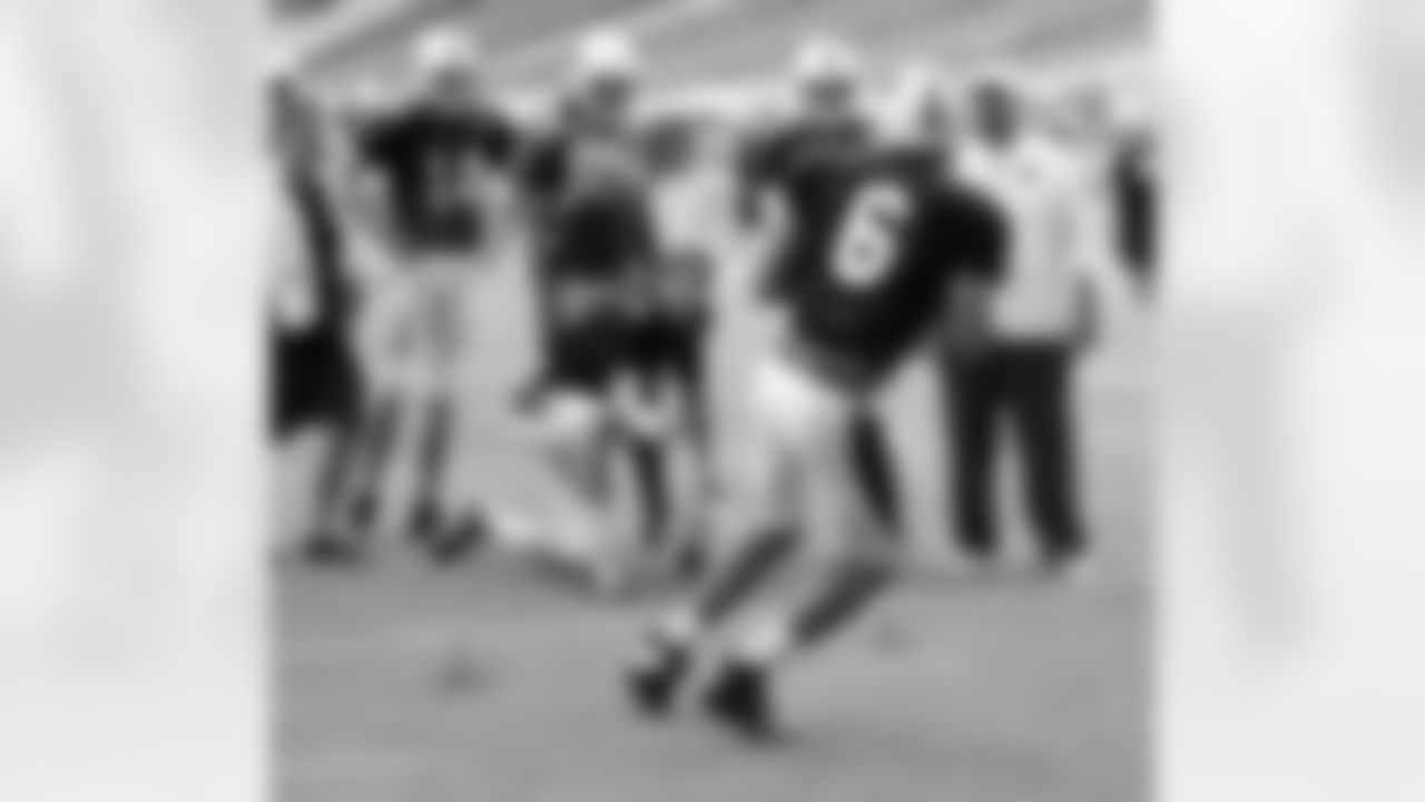 QB Logan Thomas avoids bean bags in a drill