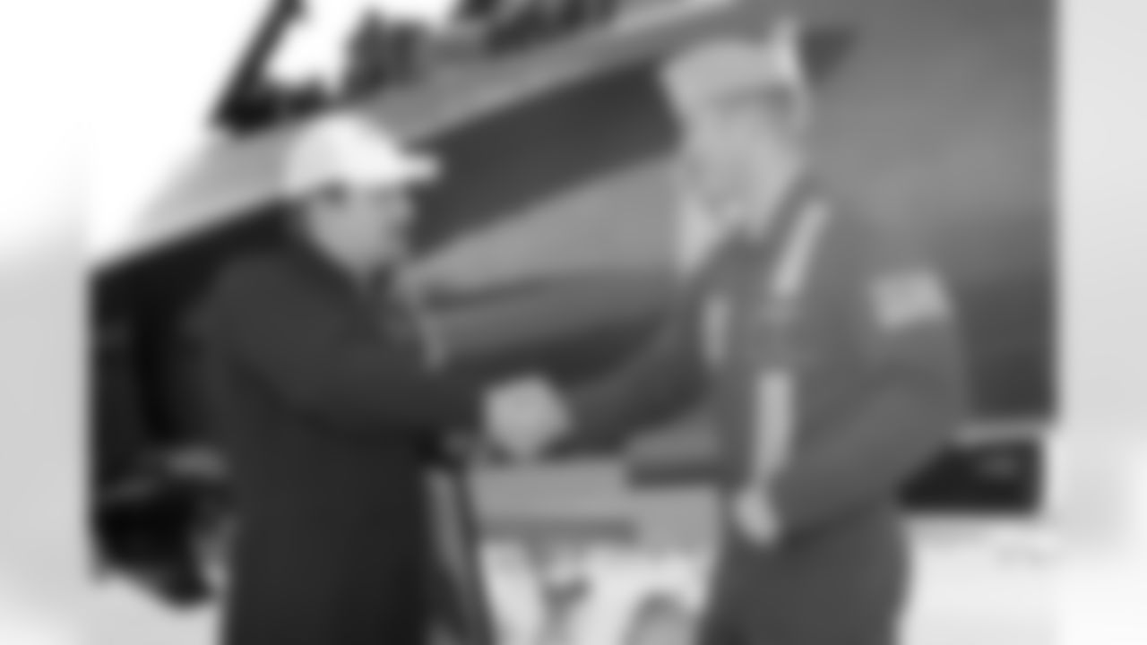 Lt. Frank Weisser shakes Bidwill's hand following the flight