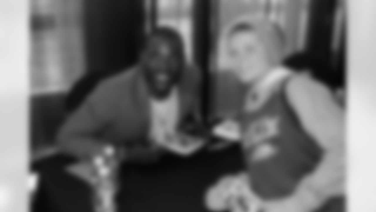 Signing autographs, Cardinals CB Patrick Peterson poses with a fan