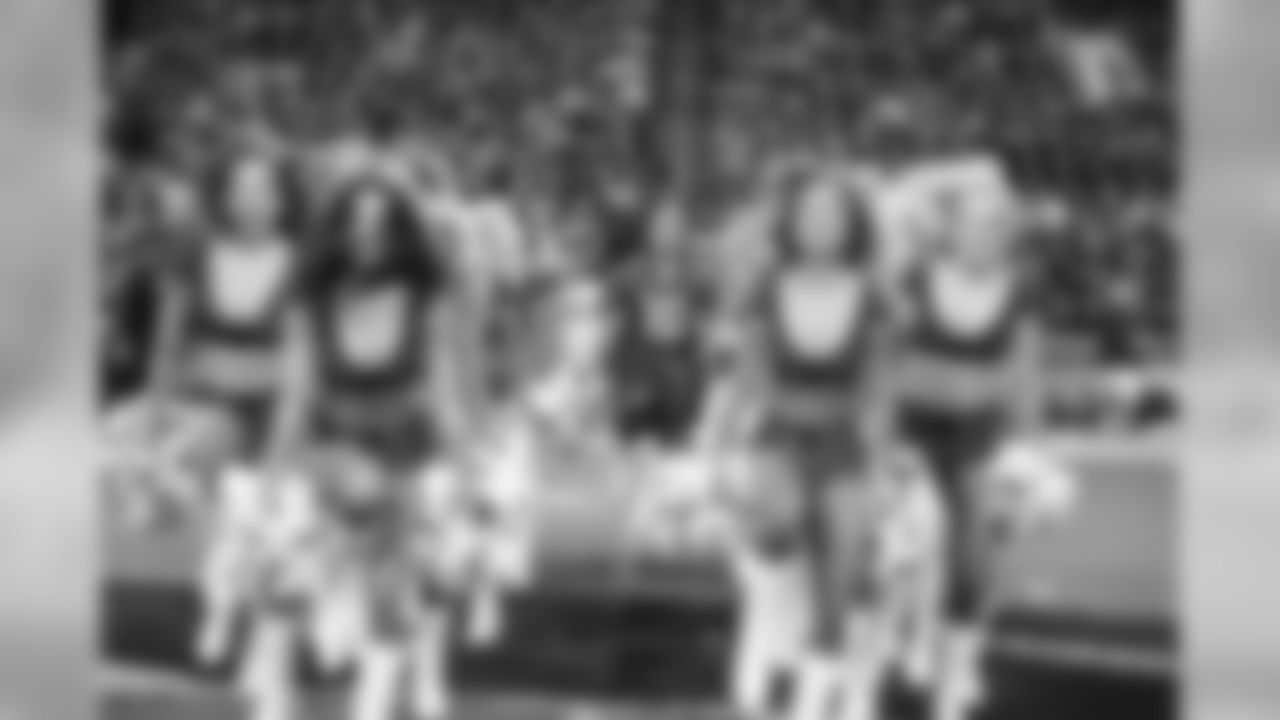 Images of the Cardinals cheerleaders practicing and performing with celebrity fitness motivator Shaun T