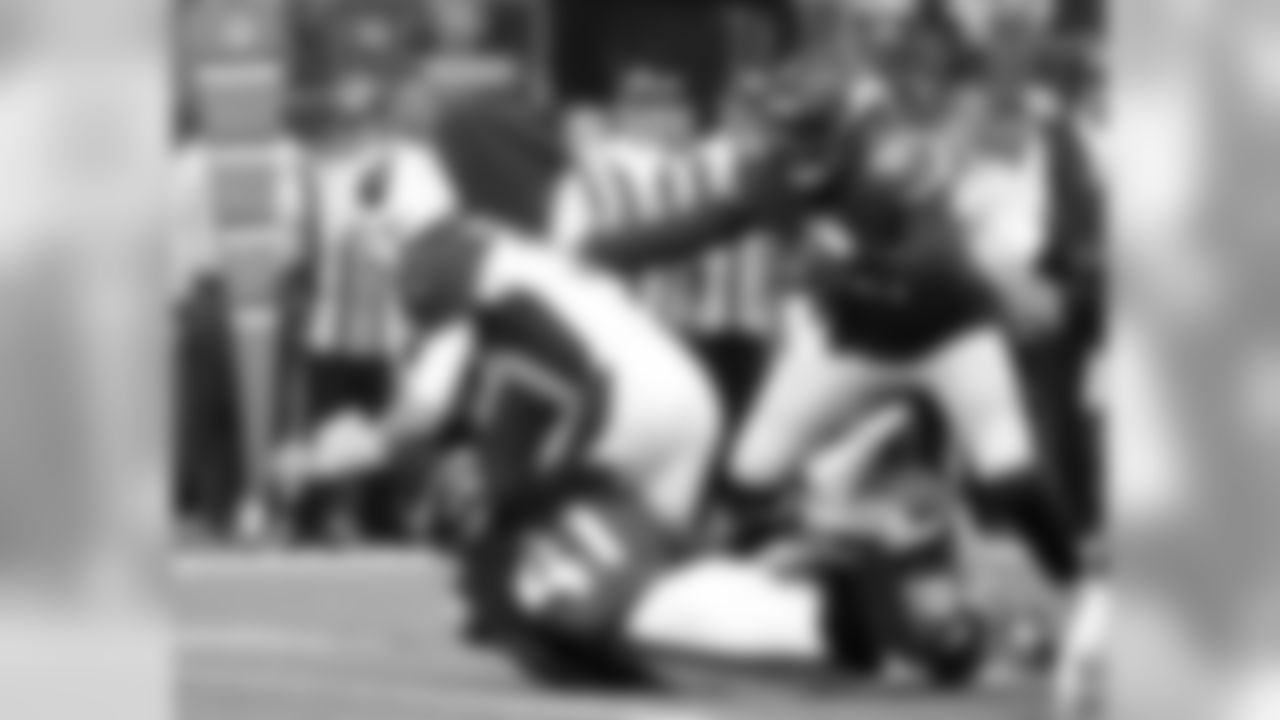 Arizona Cardinals quarterback Josh Rosen, left, is sacked by Minnesota Vikings defenders Anthony Harris (41), Mackensie Alexander (20) and Stephen Weatherly (91) during the first half of an NFL football game, Sunday, Oct. 14, 2018, in Minneapolis.