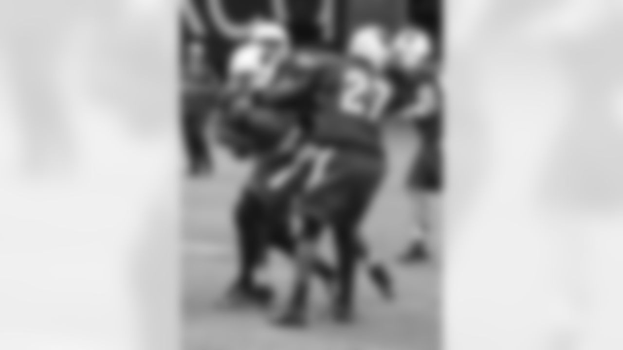 RB Robert Hughes is wrapped up by S Curtis Taylor