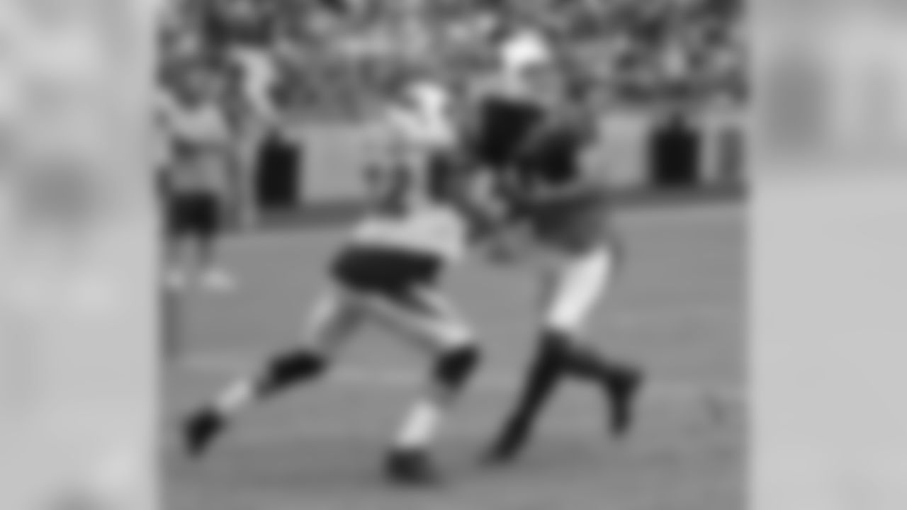 S Tyrann Mathieu and WR Larry Fitzgerald battle