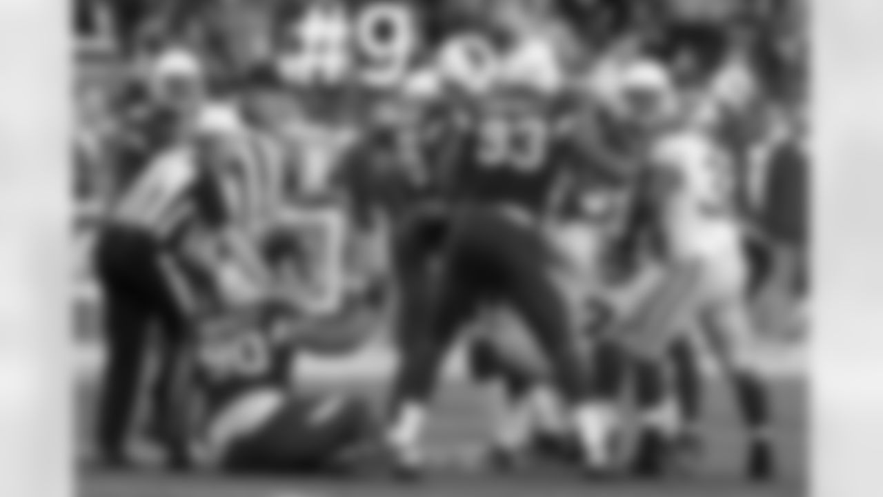 DT Darnell Dockett gets pushed down after tackling Colin Kaepernick.