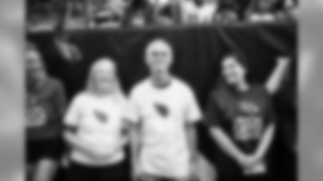 Images from halftime of the Falcons game, where Cardinals cheerleaders performed with cancer survivors and their caregivers to raise awareness for early detection and prevention