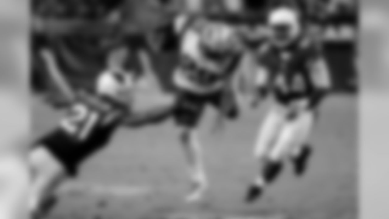 Patriots RB LeGarrette Blount stumbles forward against CB Patrick Peterson (left) and LB Markus Golden (right)