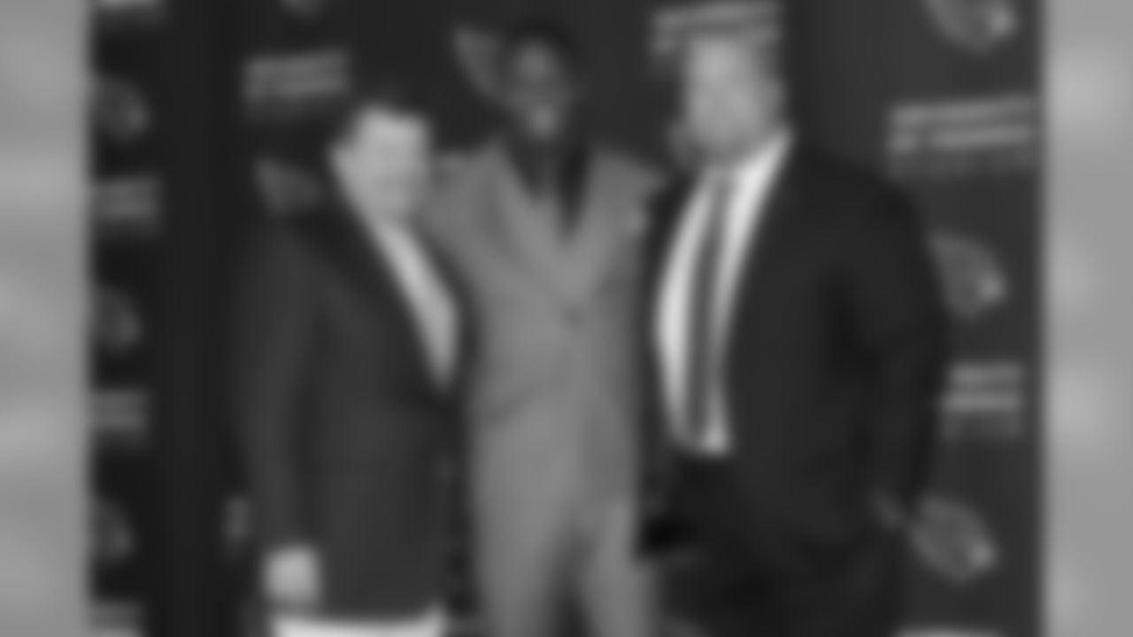 Wilson with team president Michael Bidwill (left) and GM Steve Keim (right)