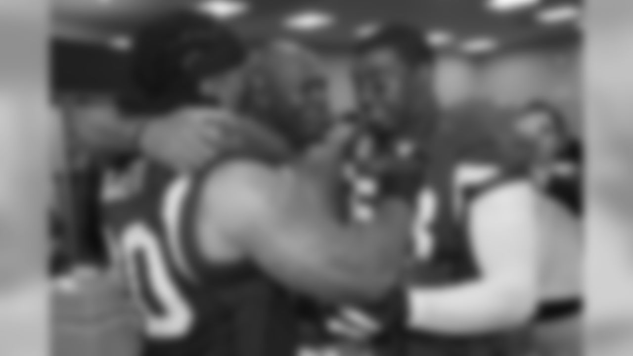 From left: DT Darnell Dockett, DE Bertrand Berry, LB Karlos Dansby celebrate postgame