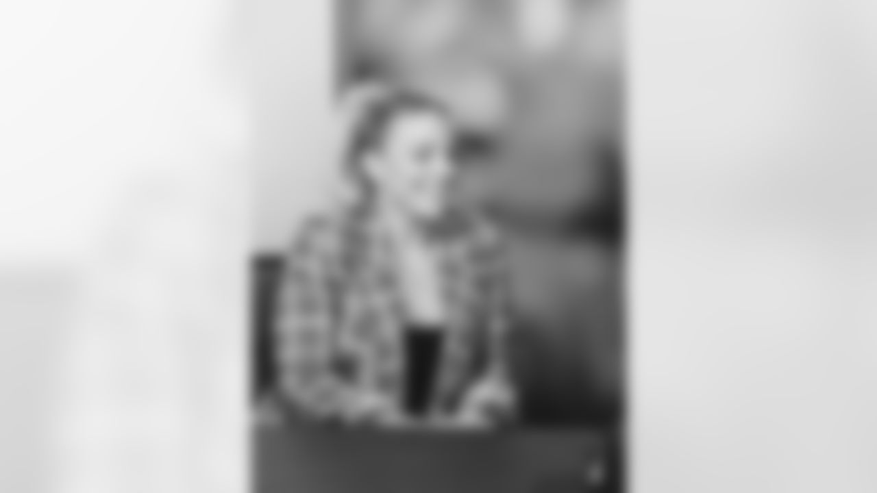 Julie Ertz smiles during the contract signing.