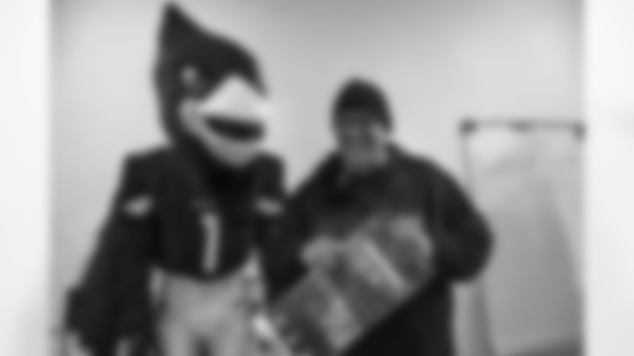Arizona Cardinals linebacker Dennis Gardeck (45) presents Orin Wakefield with Super Bowl tickets on Tuesday, Jan. 24, 2023 in Phoenix, AZ.