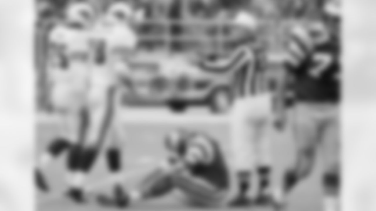 1974: Eagles QB Roman Gabriel sits on the field after getting sacked.