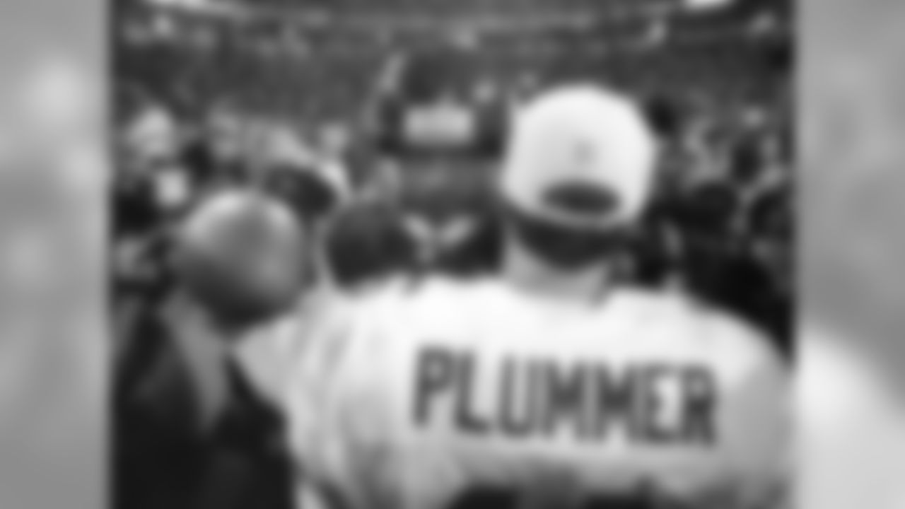 1999: QB Jake Plummer with Vikings QB Randall Cunningham after the playoff game