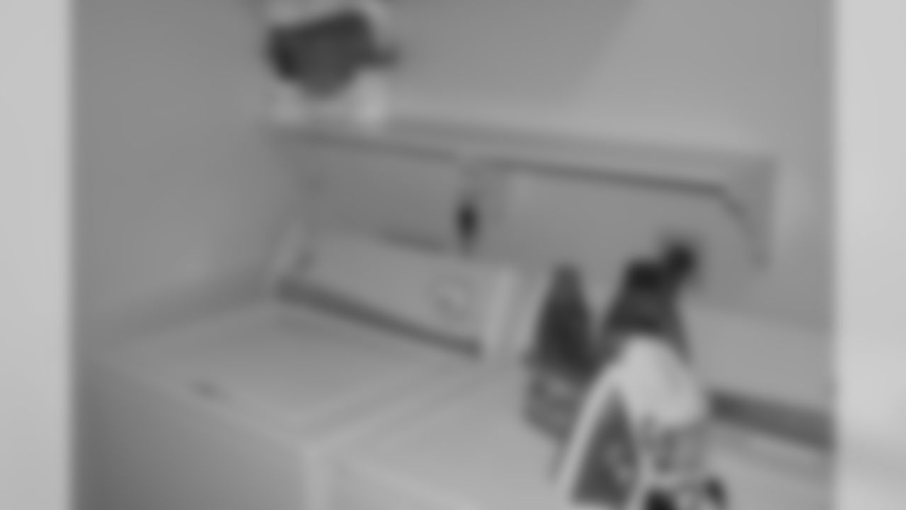 Laundry room comes with a washer and dryer.