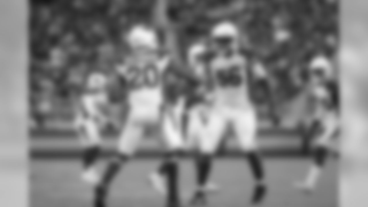 LB Karlos Dansby (right) celebrates his late interception with teammate Deone Bucannon (left)