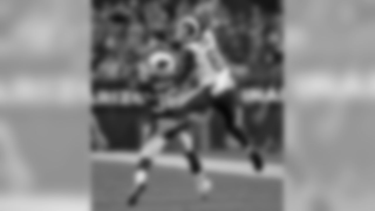 Cardinals S Budda Baker and Rams TE Gerald Everett go up for the ball