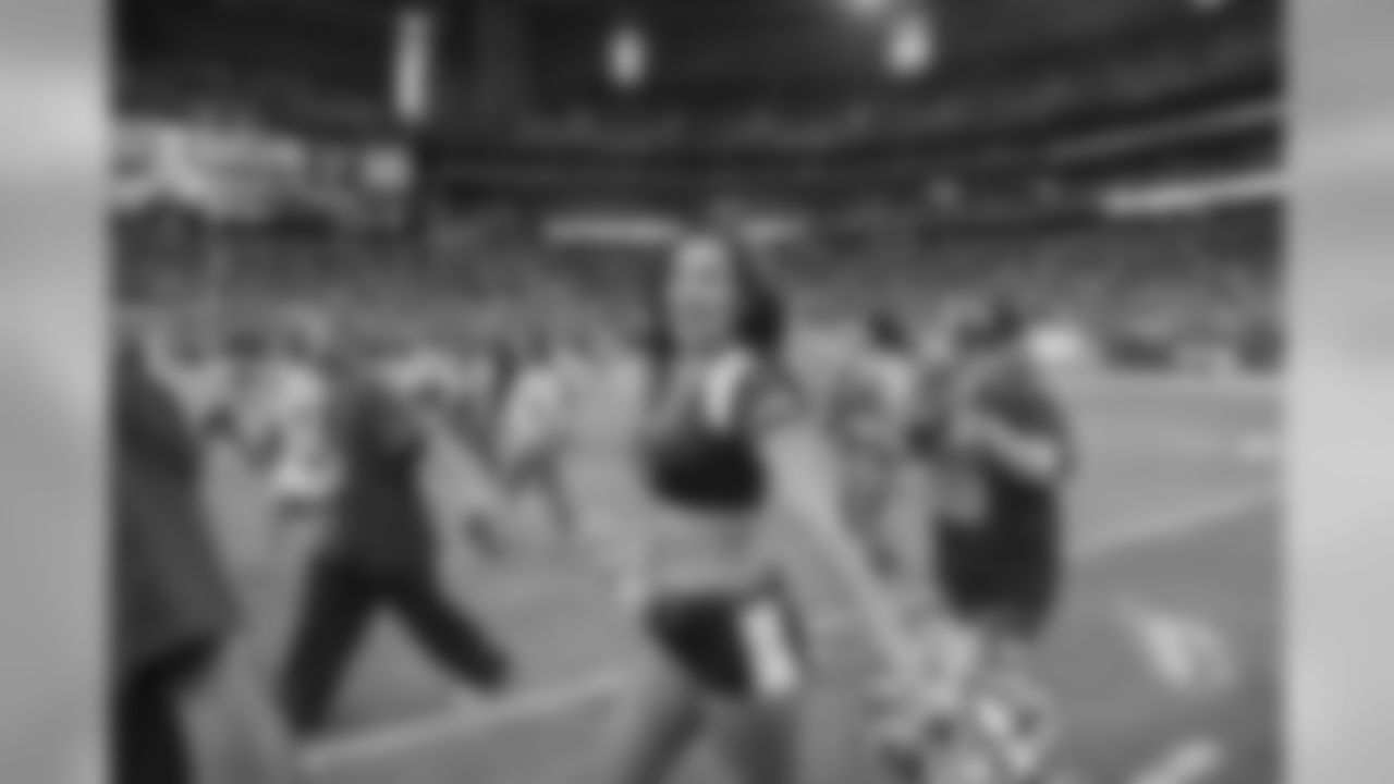 Images from halftime of the Falcons game, where Cardinals cheerleaders performed with cancer survivors and their caregivers to raise awareness for early detection and prevention