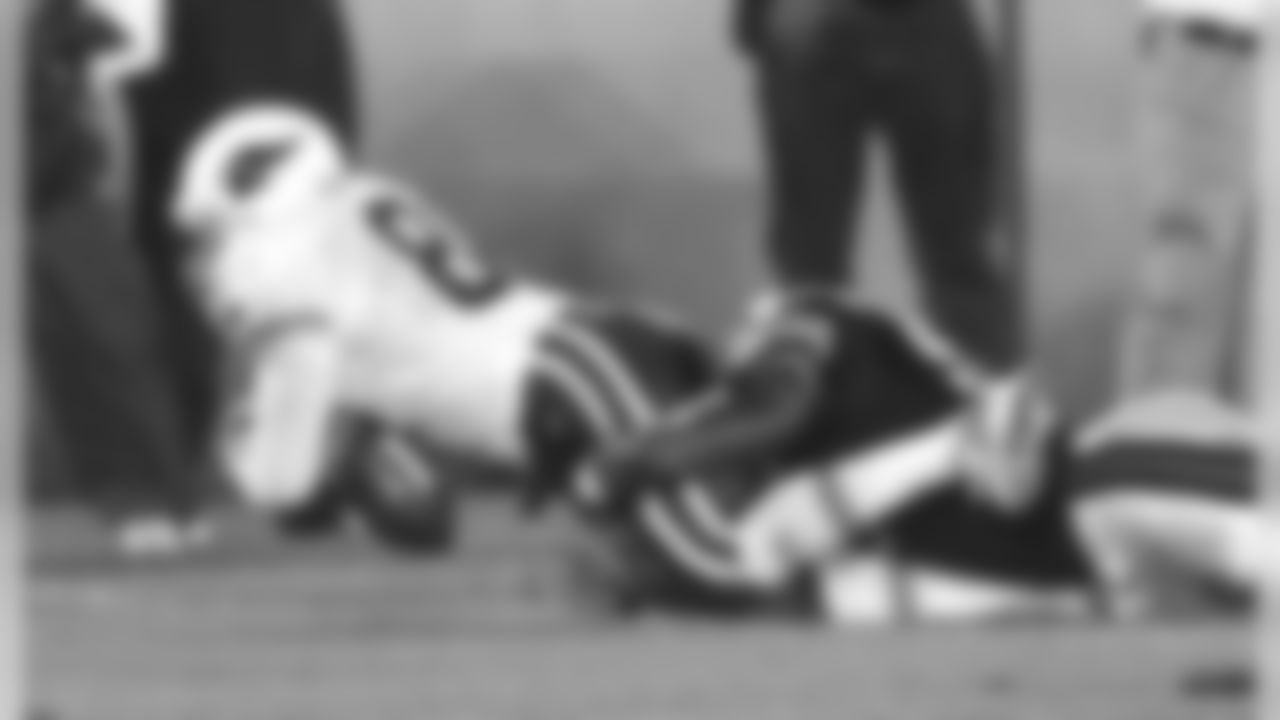 Arizona Cardinals' Terry Hardy (80) loses the ball as Chicago Bears linebacker Greg Jones (55) tackles him during the third quarter, Saturday, Aug. 25, 2001, in Chicago.