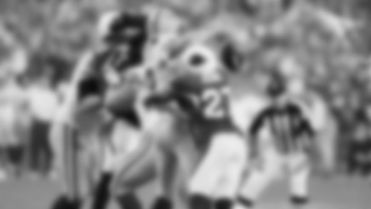 DB Michael Adams forces a fumble on Packers QB Aaron Rodgers.