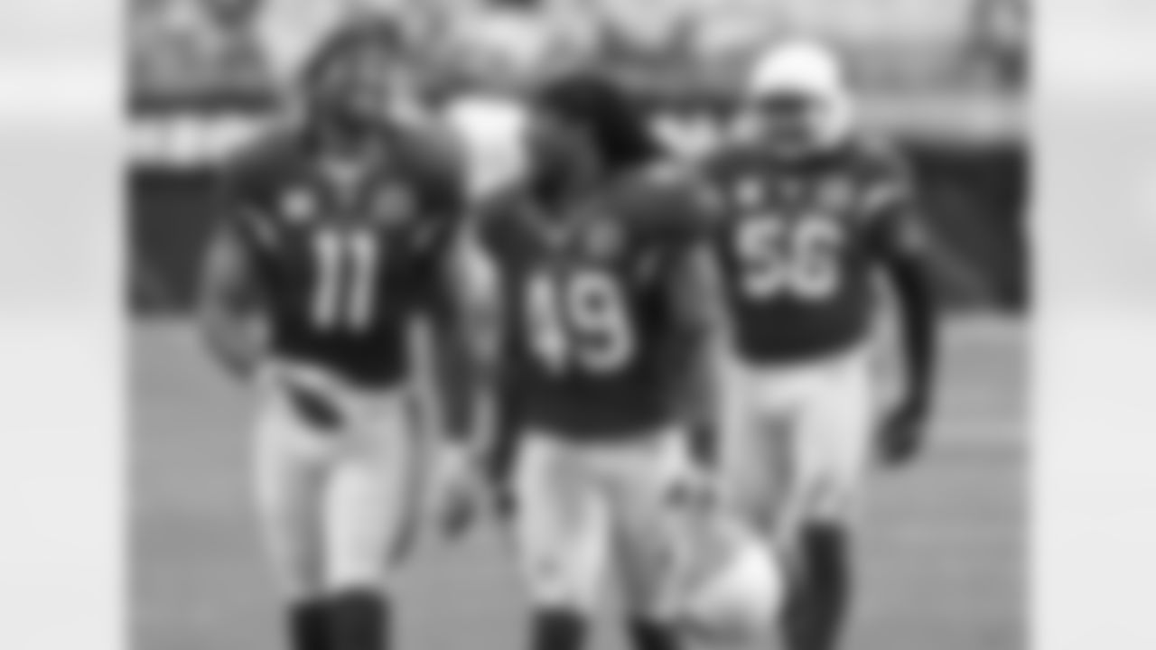 2012: WR Larry Fitzgerald (left) and S Rashad Johnson celebrate a victory