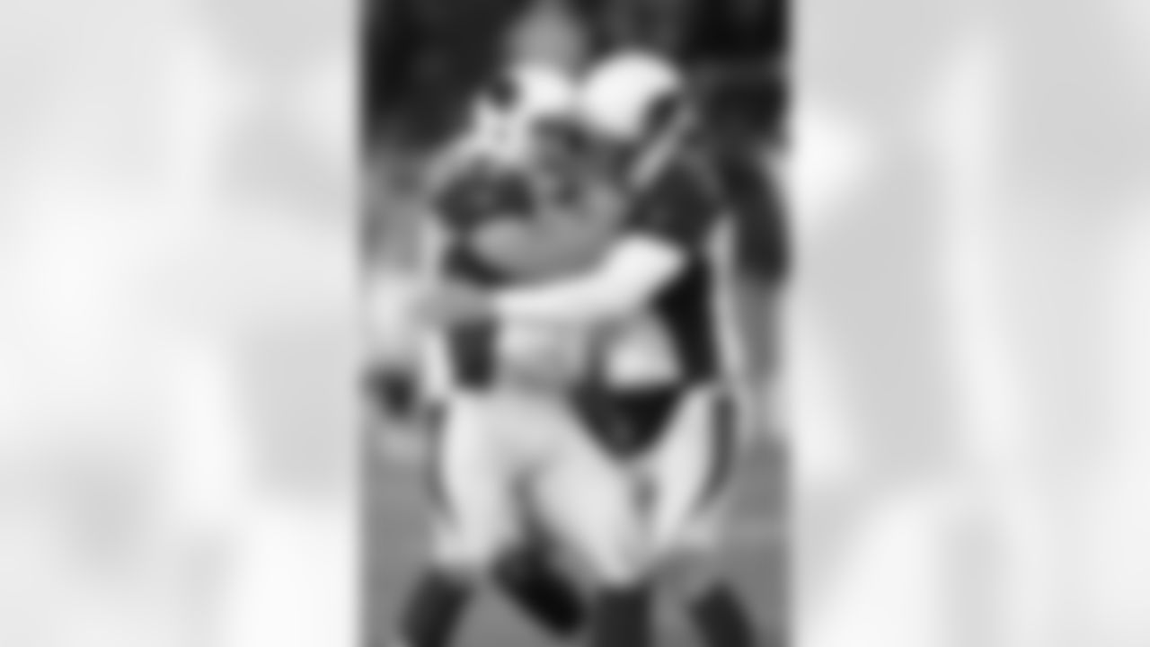 K Jay Feely celebrates his game-winning field goal against the Titans with P Dave Zastudil.
