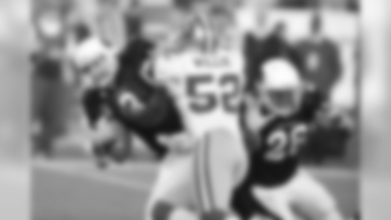 QB Derek Anderson is hit by 49ers LB Patrick Willis in 2010
