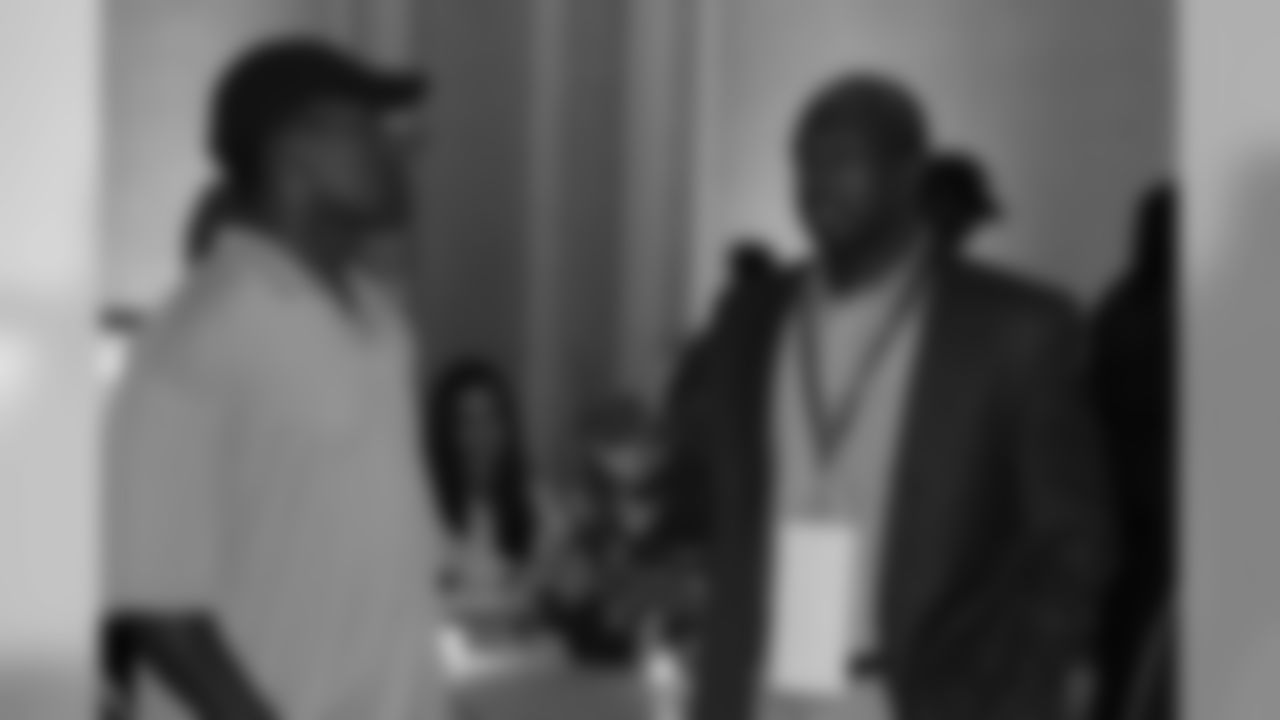 Ex-Cardinals cornerback Corey Chavous talks with Cardinals assistant director of pro scouting Malik Boyd at the reception
