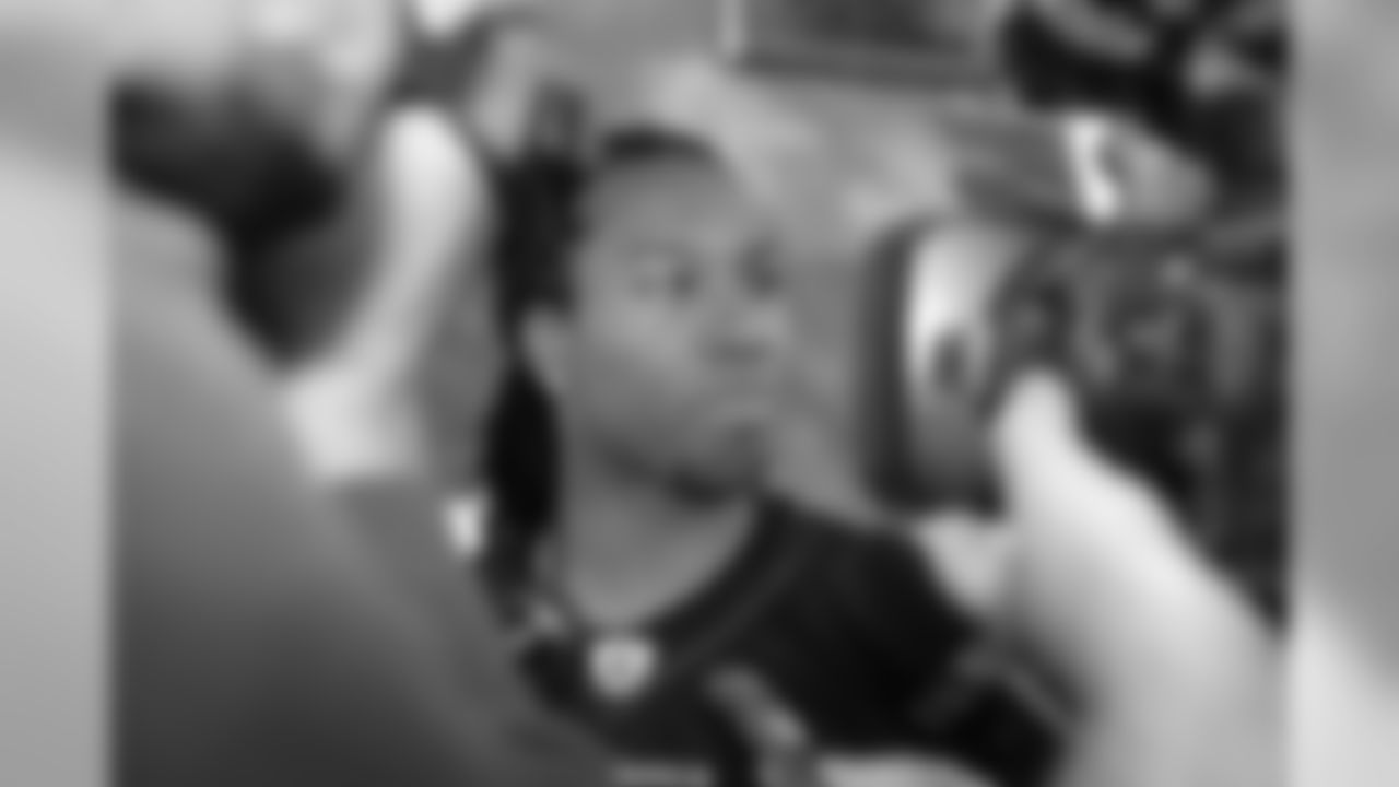 WR Larry Fitzgerald interviewed by reporters.