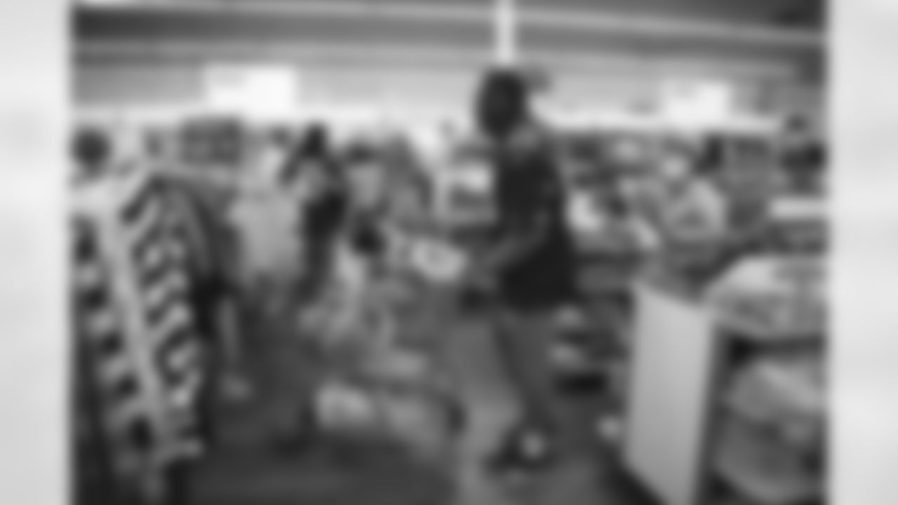 The Arizona Cardinals participate in Shop With A Jock with Desert Financial Credit Union at Walmart on Tuesday, December 13, 2022 in Tempe, AZ.