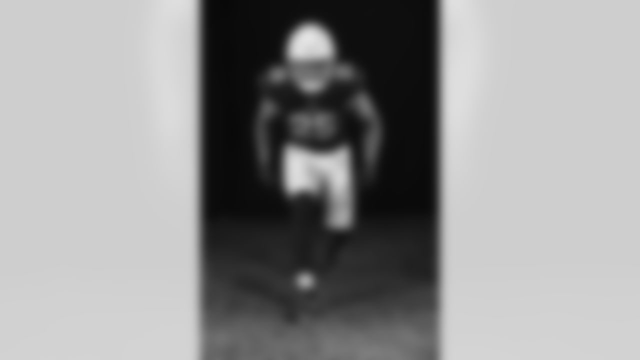 Arizona Cardinals linebacker Zaven Collins (25) poses for a photo during Cardinals Media Day on Monday, June 13, 2022 in Tempe, AZ.