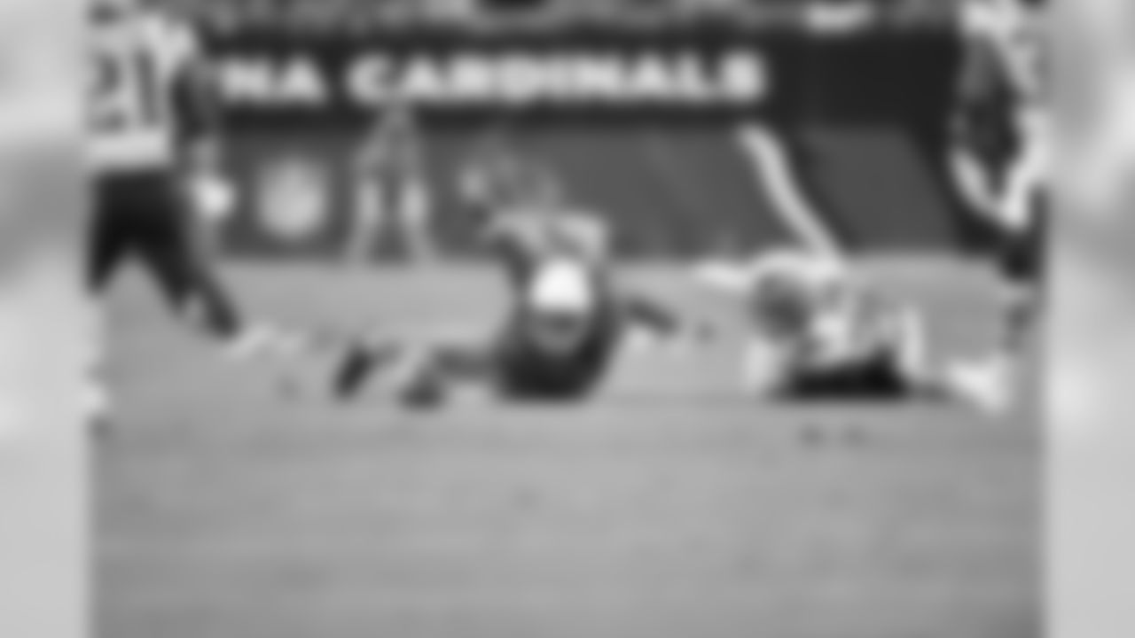 WR Larry Fitzgerald stretches for the first down marker