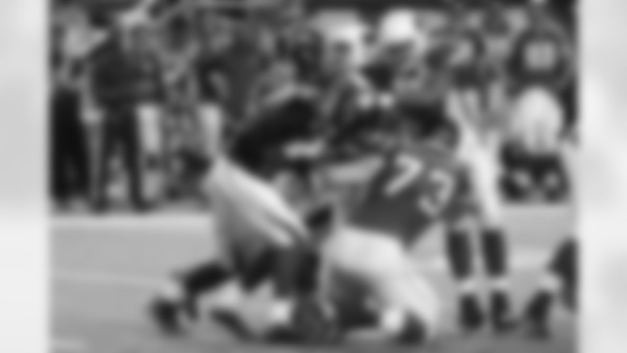Lorenzo Alexander and Alex Okafor try to bring down Matt Ryan