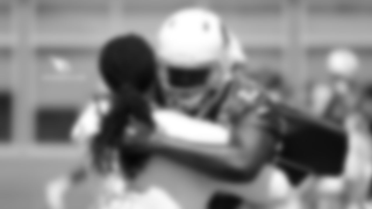 DE Markus Golden (left) and DE Chandler Jones hug it out
