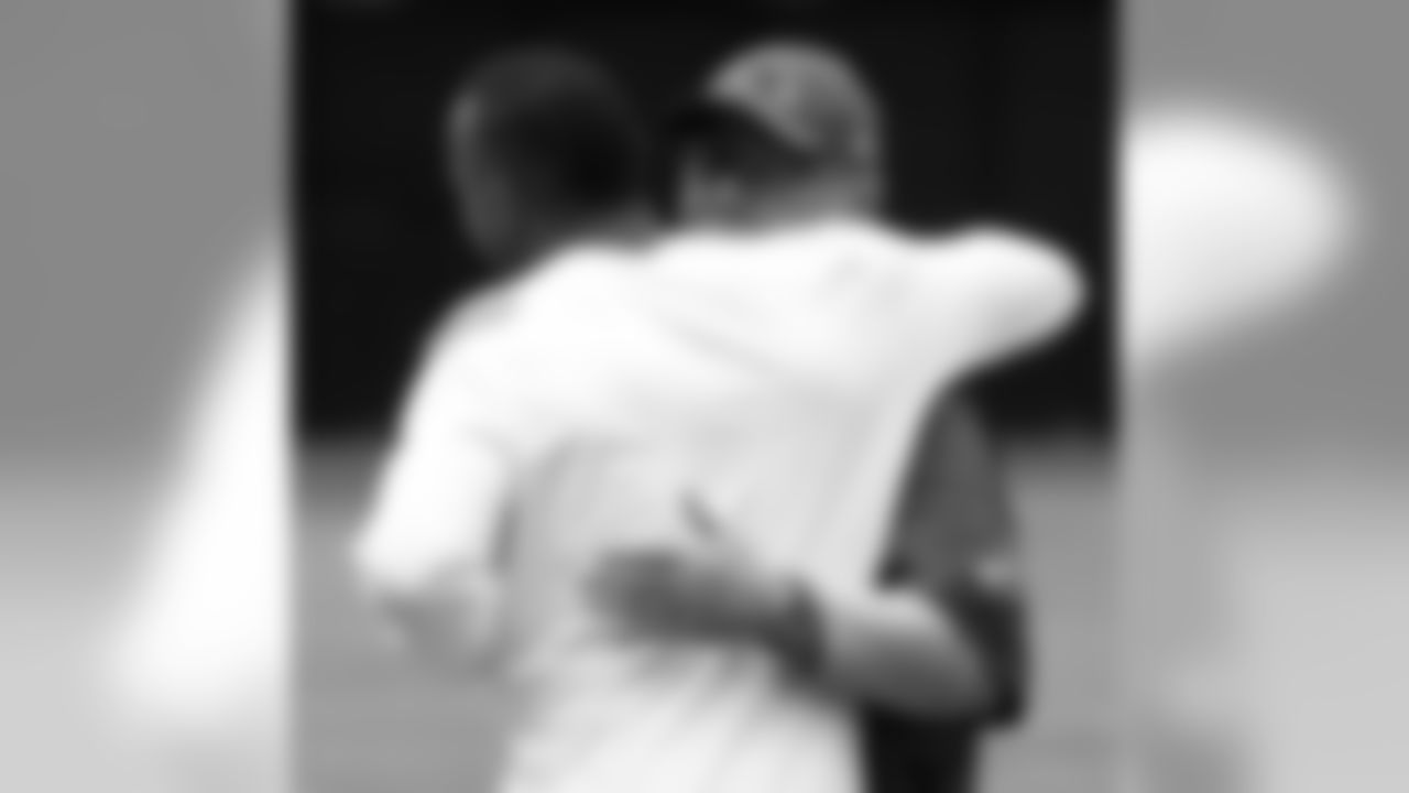 WR Michael Floyd gets a hug from coach Bruce Arians