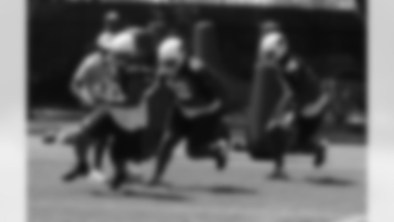 The defensive line goes through drills