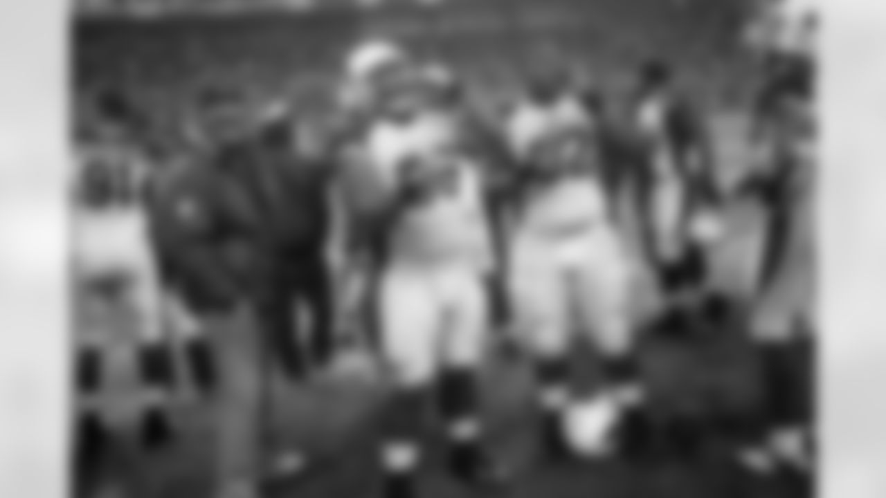 Week 16: DT Alameda Ta'amu and DT Dan Williams eat Skittles on the sidelines in Seattle.